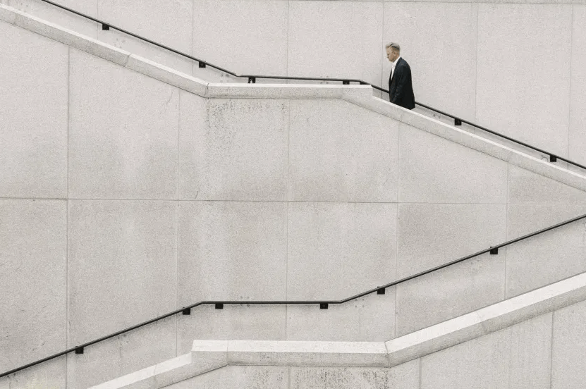 man walking up stairs