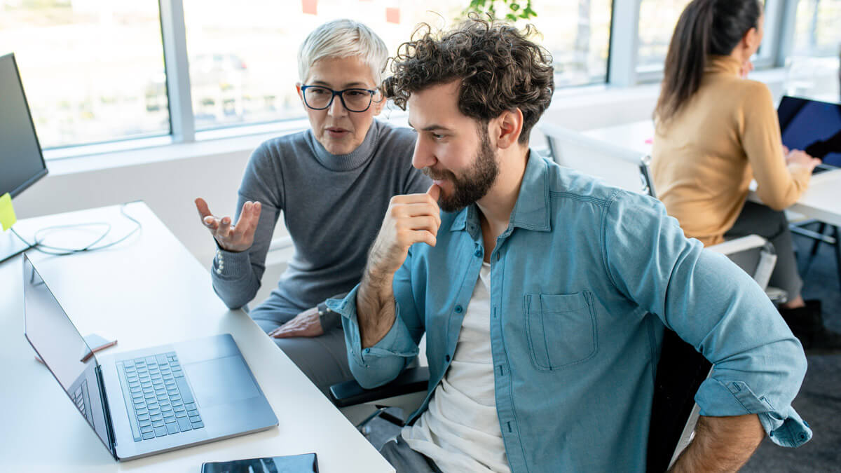 security professionals collaborating at a desk